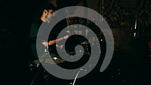 A young drummer is practicing his skills. Close-up shot of a drummer playing a drum kit.