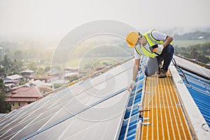 Young electrical engineer Work in a photovoltaic power plant Checking solar panel quality And control the electricity in the