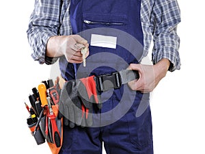 Young electrician technician in clothes and work tools isolated