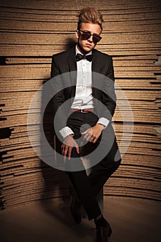 Young elegant business man sitting on a chair