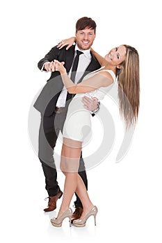 Young elegant couple dancing