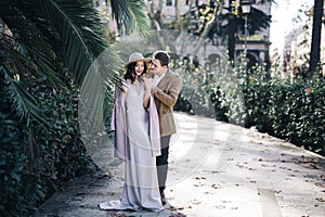 Young elegant fashion couple in park