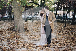 Young elegant fashion couple in park