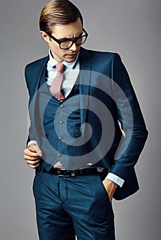 Young elegant handsome businessman in a suit