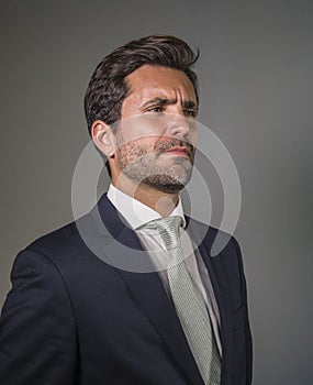 Young elegant and handsome businessman in suit and tie posing for company corporate portrait relaxed and confident isolated on wh