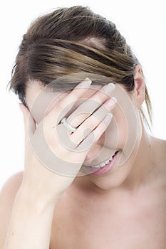 Young Embarrassed Shy Woman Hiding Eyes with Hand Smiling