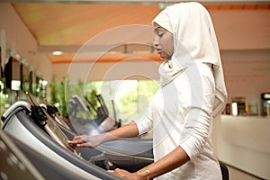 Young Emirati arab women wroking out in a Gym