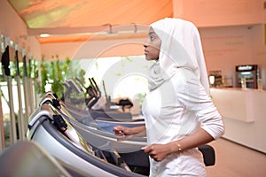 Young Emirati arab women wroking out in a Gym
