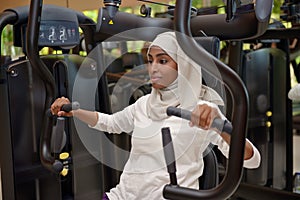 Young Emirati arab women wroking out in a Gym