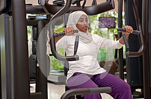 Young Emirati arab women wroking out in a Gym