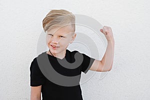 Young emotional boy on bright background