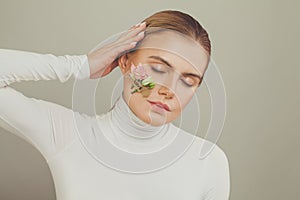 Young emotional woman falling in love on white background