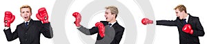 The young employee with boxing gloves isolated on white