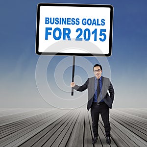 Young employee with business goals for 2015