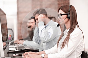 Young employee call center talking with the client