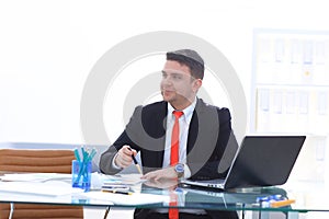 Young employee looking at computer monitor during working day