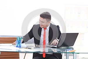 Young employee looking at computer monitor during working day