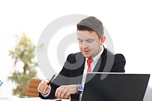 Young employee looking at computer monitor during working day