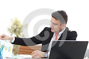 Young employee looking at computer monitor during working day