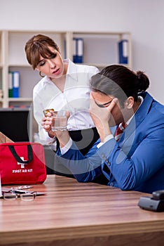 Young employee suffering in the office