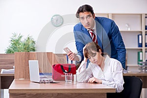 Young employee suffering in the office