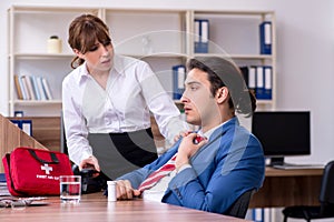 Young employee suffering in the office