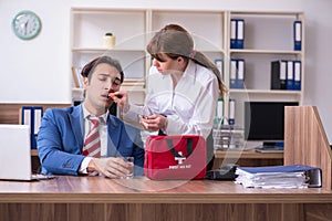 Young employee suffering in the office