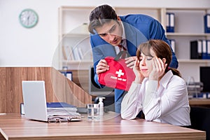 Young employee suffering in the office