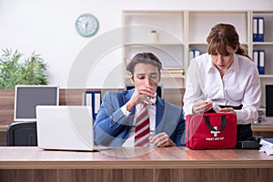 Young employee suffering in the office