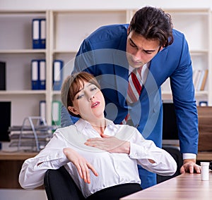 Young employee suffering in the office