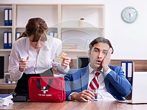 Young employee suffering in the office