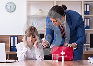 Young employee suffering in the office