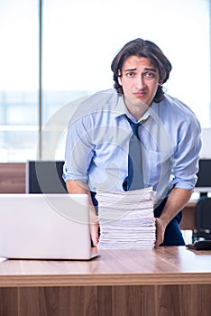 Young employee unhappy with excessive work