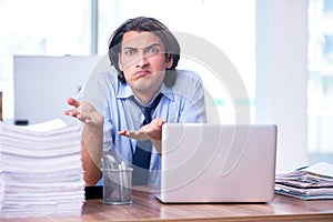 Young employee unhappy with excessive work