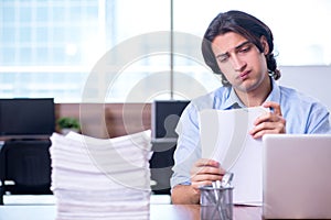 Young employee unhappy with excessive work