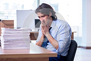 Young employee unhappy with excessive work