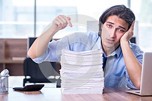 Young employee unhappy with excessive work