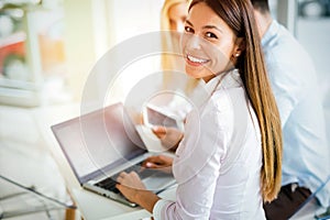 Young employee working on computer during working day in office