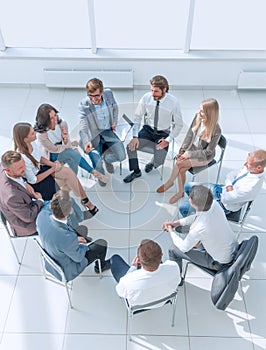 Young employees ask questions during business training