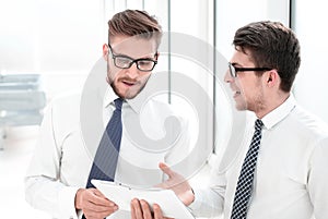 Young employees looking at the digital tablet screen