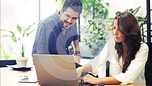 Young employees working together in a bright office.