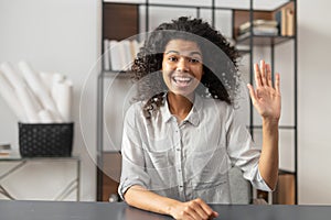 African-American woman saying hey on an interview photo