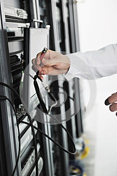 Young it engeneer in datacenter server room