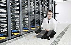 Young it engeneer in datacenter server room