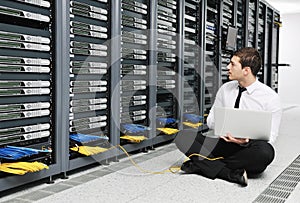 Young it engeneer in datacenter server room