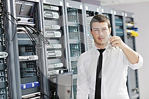 Young it engeneer in datacenter server room