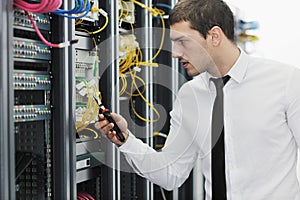 Young it engeneer in datacenter server room