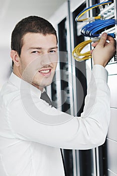 Young it engeneer in datacenter server room