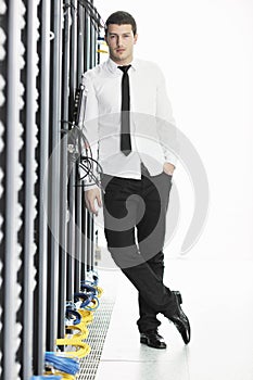 Young it engeneer in datacenter server room