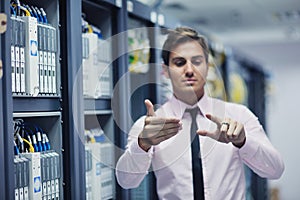 Young it engeneer in datacenter server room